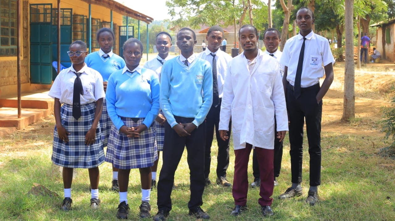 Students with their science teacher